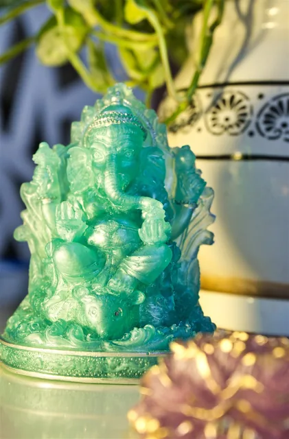 Handmade green resin Ganesha idol with shimmering details